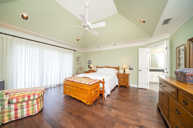 bedroom featuring dark wood-type flooring, lofted ceiling, connected bathroom, crown molding, and ceiling fan