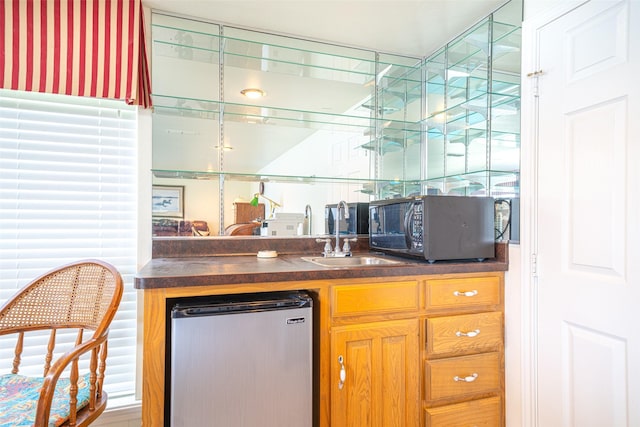 bar with stainless steel refrigerator and sink