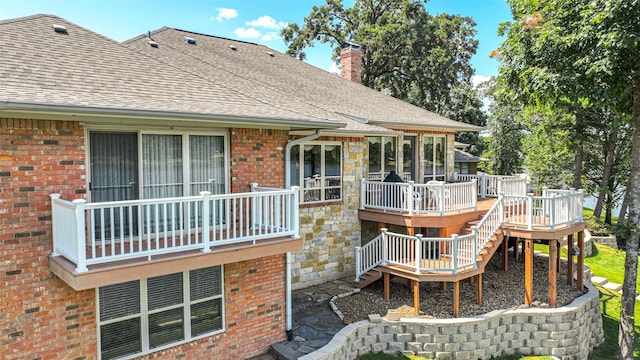 rear view of property featuring a deck