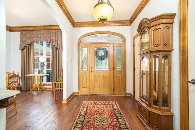 entrance foyer featuring dark wood-type flooring and ornamental molding