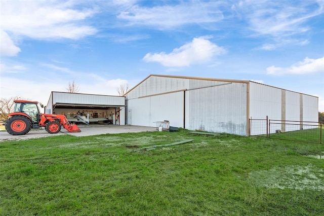 view of outbuilding featuring a lawn