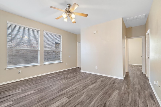 unfurnished room featuring ceiling fan and dark hardwood / wood-style flooring