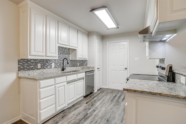 kitchen with dishwasher, stove, white cabinets, and sink