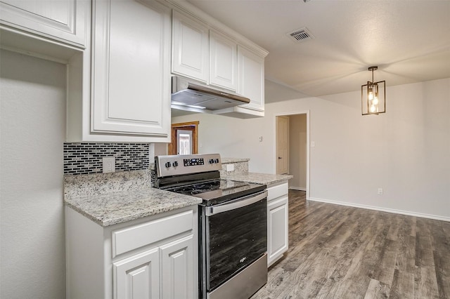 kitchen with decorative backsplash, light stone countertops, electric stove, pendant lighting, and white cabinetry