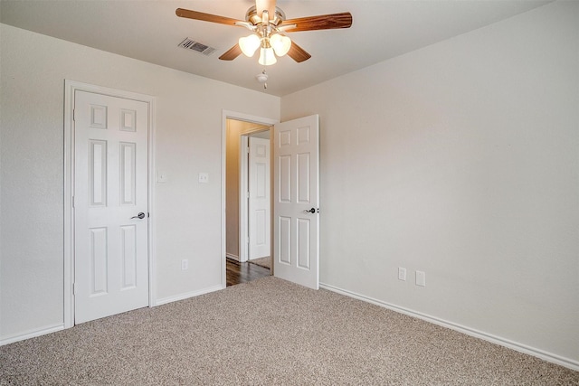 unfurnished bedroom with carpet and ceiling fan