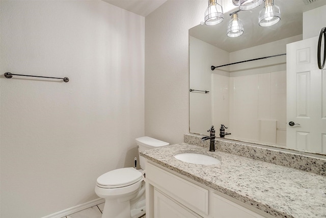 bathroom with a shower, tile patterned flooring, vanity, and toilet