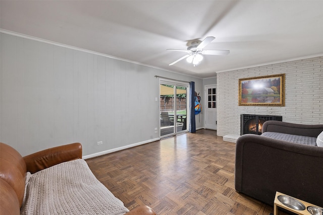 living room featuring a fireplace, dark parquet flooring, ceiling fan, and crown molding