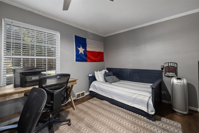 bedroom featuring ceiling fan, wood-type flooring, and ornamental molding