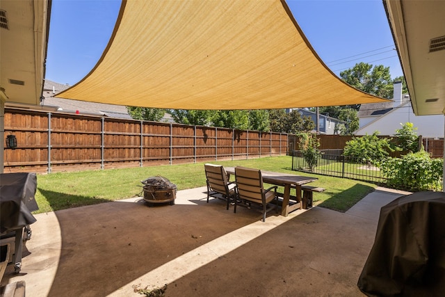 view of patio with a grill and an outdoor fire pit