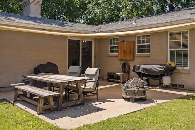 view of patio featuring a fire pit and area for grilling