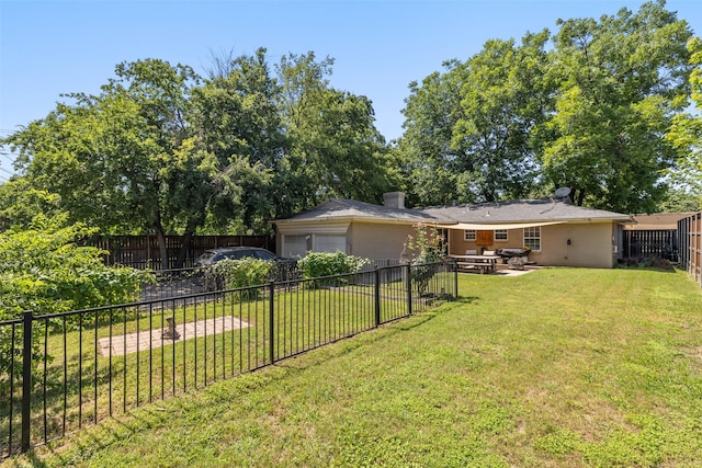 view of yard featuring outdoor lounge area, a patio, and a garage