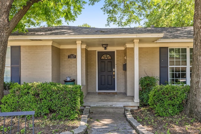 property entrance featuring covered porch