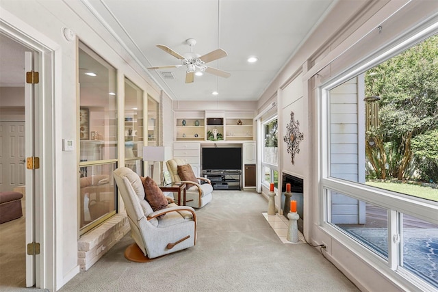 sunroom / solarium with ceiling fan