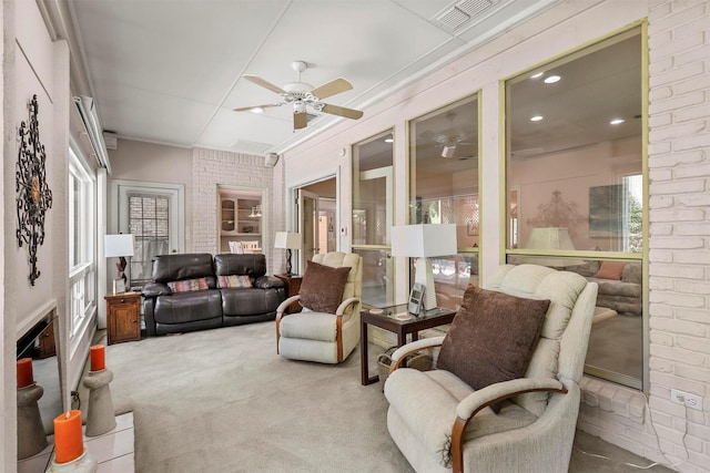 sunroom featuring ceiling fan