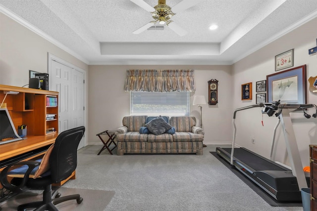 office featuring ceiling fan, a raised ceiling, and a textured ceiling