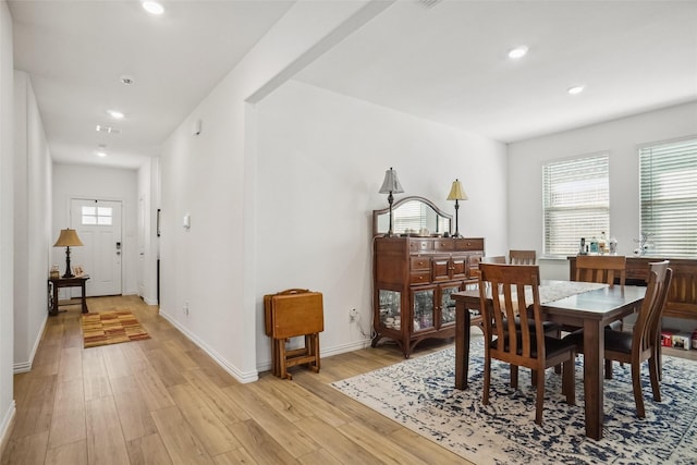 dining room featuring a wealth of natural light and light wood-type flooring