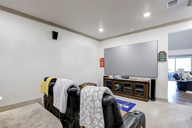 cinema room featuring ornamental molding