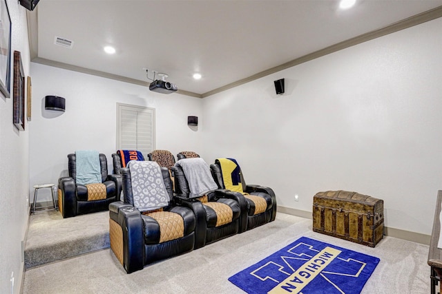 cinema room with carpet flooring and crown molding