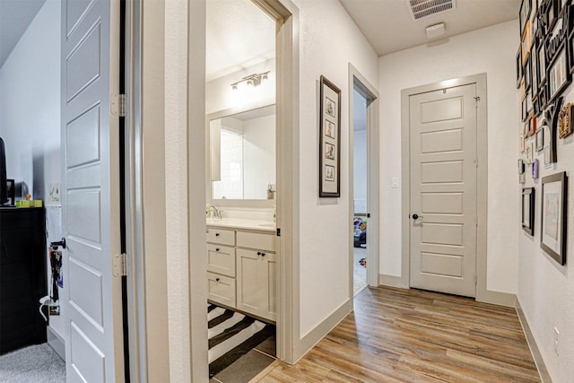 hallway featuring light wood-type flooring