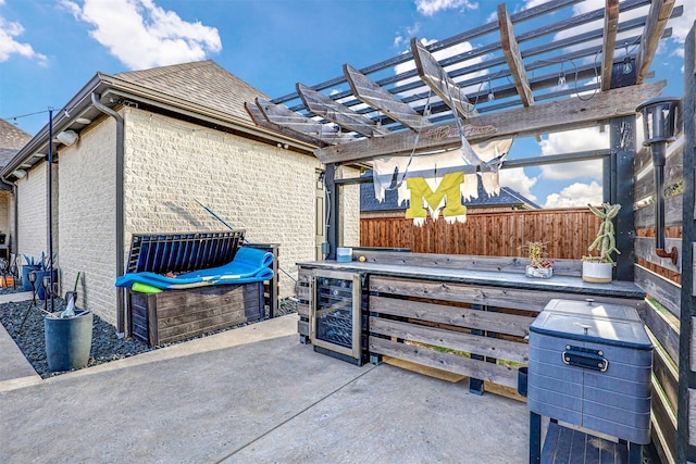 view of patio / terrace with a pergola and wine cooler