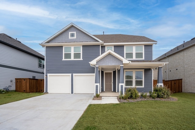 view of front of home with a front yard and a garage