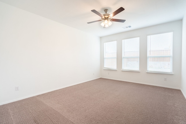 carpeted empty room with ceiling fan