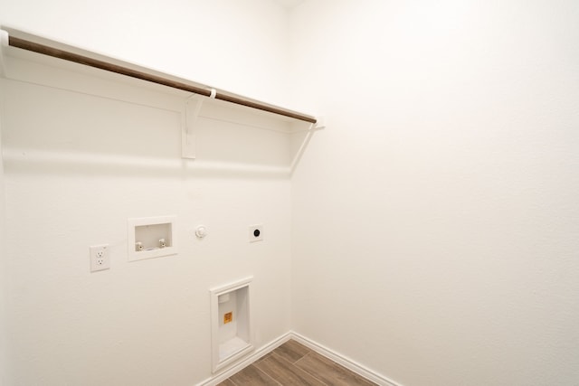 laundry room featuring gas dryer hookup, hookup for an electric dryer, hookup for a washing machine, and hardwood / wood-style flooring