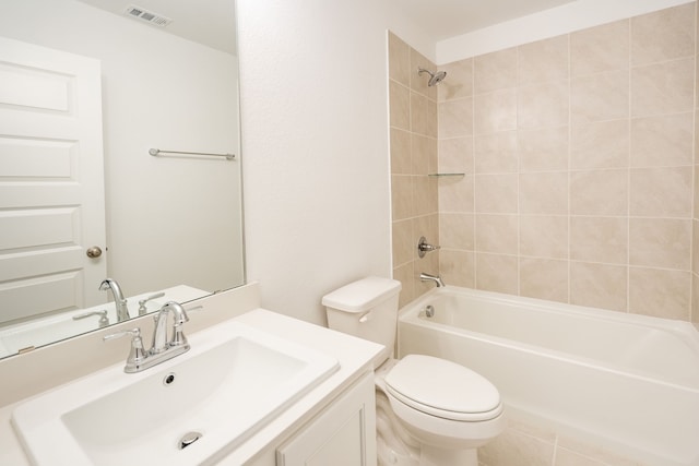 full bathroom with vanity, toilet, and tiled shower / bath combo