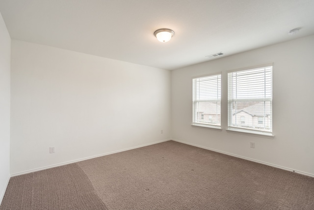 empty room with carpet flooring