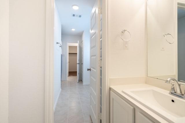 bathroom featuring tile patterned floors and vanity