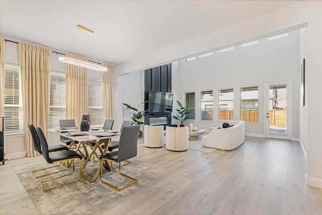 dining space with light hardwood / wood-style flooring