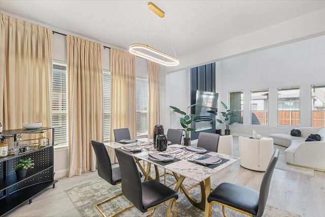 dining area featuring a chandelier and light hardwood / wood-style flooring