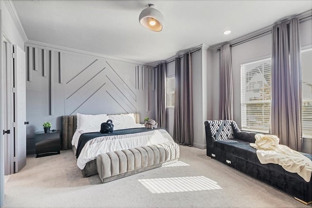 bedroom with light carpet and crown molding