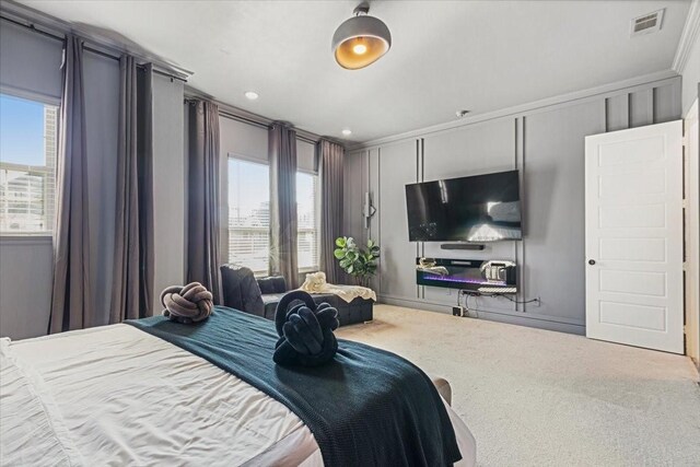 carpeted bedroom featuring ornamental molding