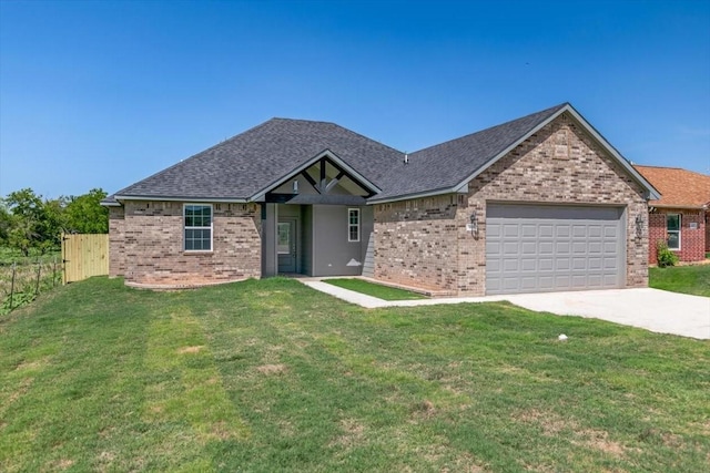 view of front of home with a garage and a front yard