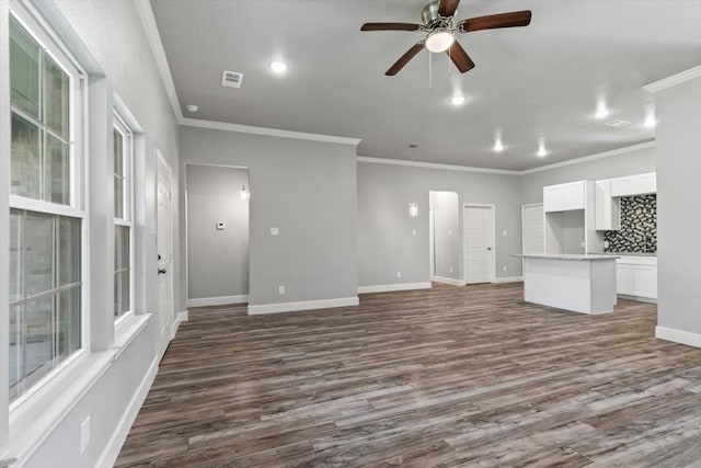 401 Mesquite Dr, Rio Vista, TX 76093 - unfurnished living room with wood-type flooring and ornamental molding