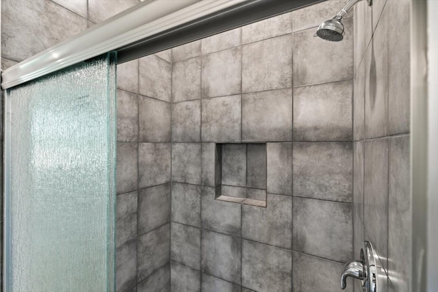 interior details with an enclosed shower