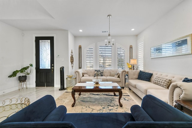 living room with a notable chandelier