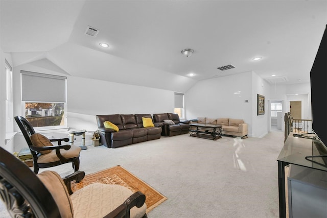 living room with vaulted ceiling and light carpet