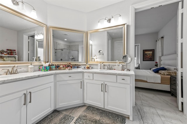 bathroom with vanity and a shower