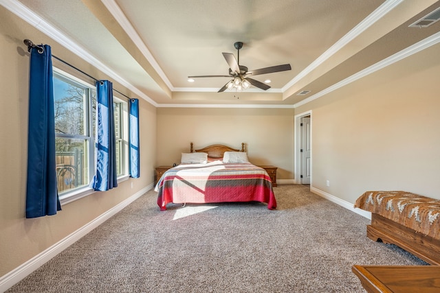 bedroom featuring a raised ceiling, crown molding, carpet flooring, and ceiling fan