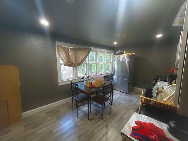 dining area with wood-type flooring