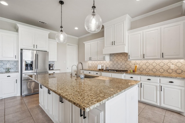 kitchen with a center island with sink, sink, white cabinetry, and stainless steel appliances