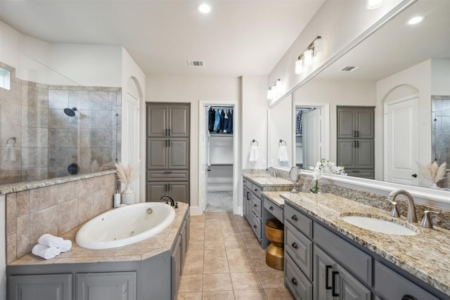 bathroom featuring separate shower and tub, tile patterned flooring, and vanity