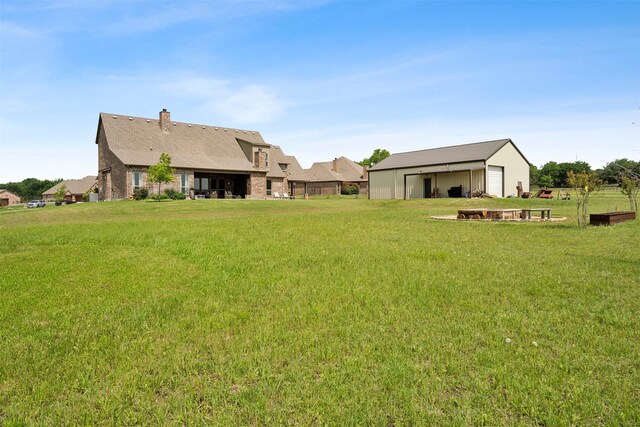 garage featuring a lawn