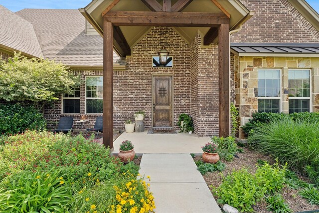 foyer entrance with a high ceiling, dark wood-type flooring, and crown molding