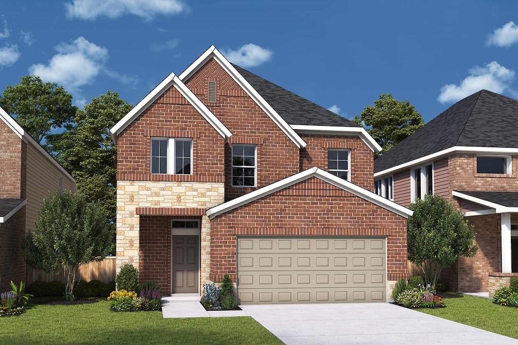 view of front facade with a garage and a front lawn