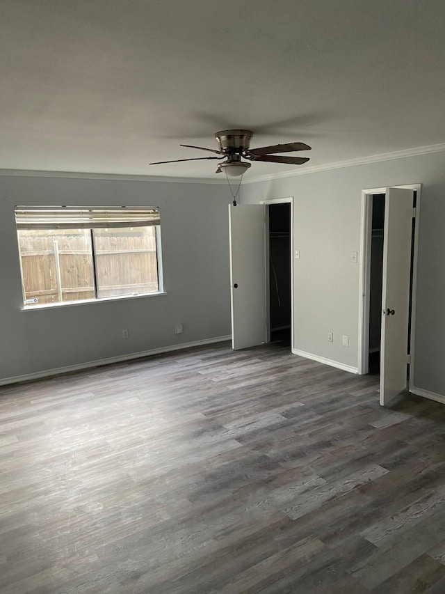 unfurnished room featuring hardwood / wood-style floors, ceiling fan, and ornamental molding