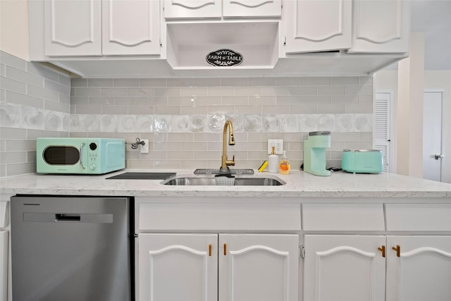 kitchen with white cabinets, backsplash, dishwasher, and sink