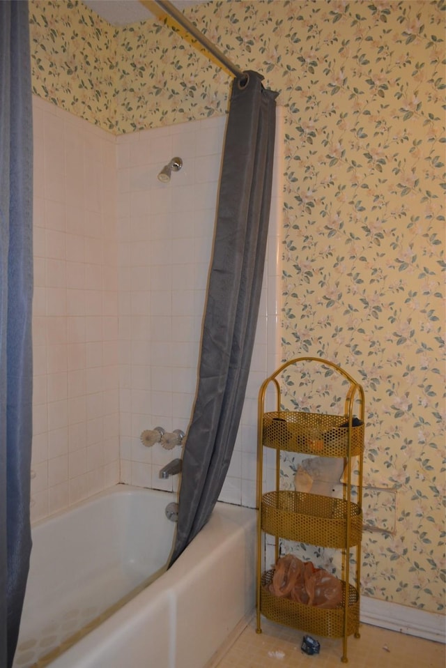 bathroom with tile patterned flooring and shower / bath combination with curtain